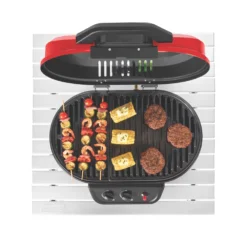 Coleman RoadTrip® 225 Portable Tabletop Propane Grill 16 Coleman RoadTrip® 225 Portable Tabletop Propane Grill -Outdoor Camping Store 2000033047 coleman grills 225 TT heritage red flames turned on food on grates overhead 3